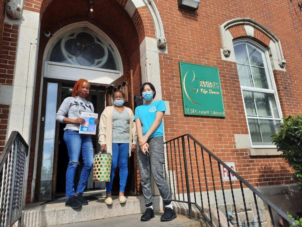 Rebecca delivering period packs to a shelter