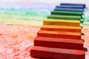 A row of chalk pieces forming a rainbow