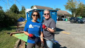 Moni Lowe poses with another Random Acts Volunteer during a Random Act of kindness during the leadership summit in 2023.