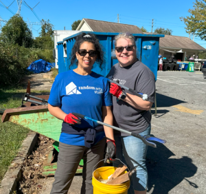 Moni poses during an Random Act of kindness with another volunteer.